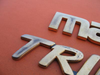 01 02 03 04 05 06 MAZDA TRIBUTE LX V6 REAR TRUNK LID GOLD EMBLEM