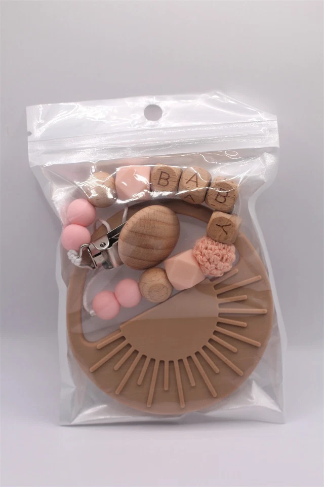 Juguete de dentición de bebé de silicona en forma de sol con clip de madera Foto 3 de 3