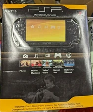 brand new sealed Sony PSP 2000 Launch Edition 64MB Handheld System - Piano Black