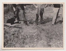 Young Girl Takes the Shot While Men Remain Out of Frame Snapshot Abstract Photo