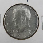 1964 Kennedy Half Dollar • About Uncirculated (AU) • Strong Strike