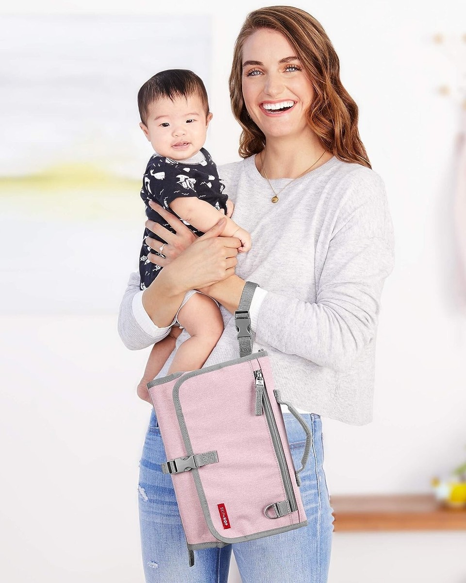 Skip Hop Pronto changing pad in Pink with zipper pockets and wipe