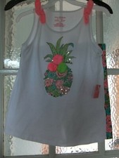 Matching set of white top with sparkle pineapple and shorts.age 7-8 years.