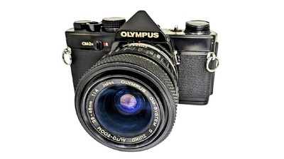 Film camera OLYMPUS OM 2N OLYMPUS S ZUIKO AUTO ZOOM 28 48mm F4 Used