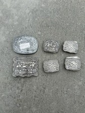 6 Hesston Belt buckles. In Original Wrapping. Very Nice.