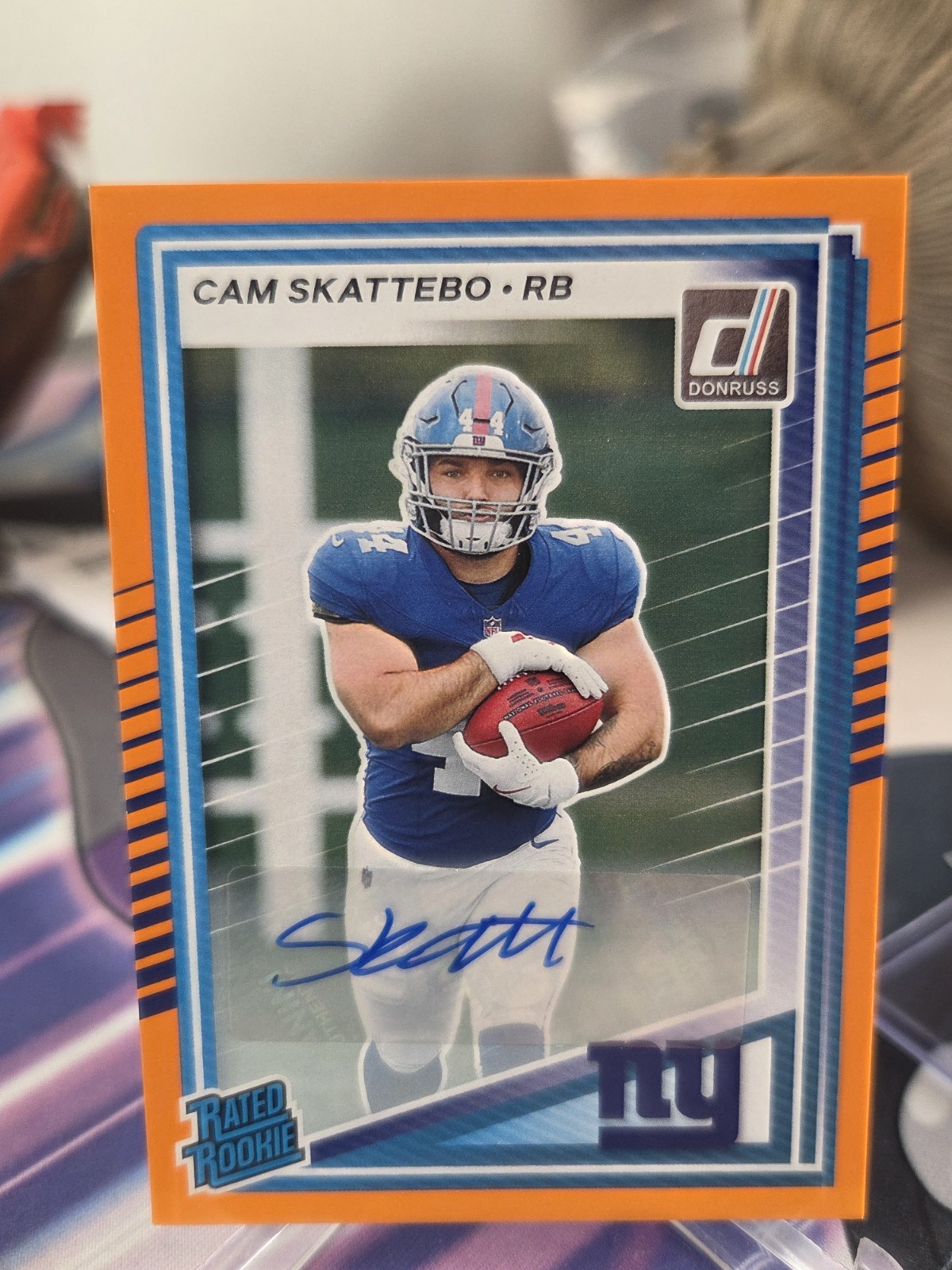Cam Skattebo 2025 Donruss Rated Rookie Auto Orange No.302