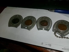 Four encased lucky pennies