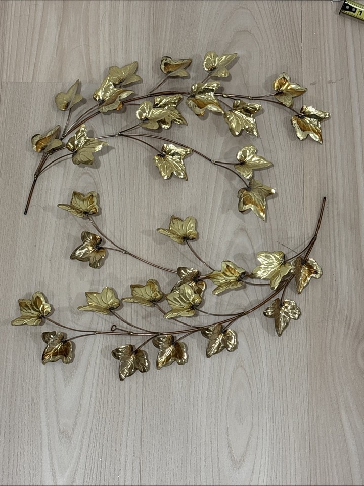 A sculptural set of vintage gold metal leaf wall art — understated MCM elegance that looks far more expensive than the asking price.