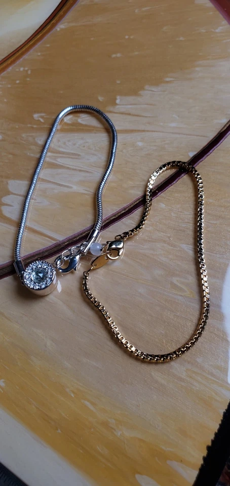 Pulseras Avon vintage una de oro y otra de plata con dije BRILLANTE. Foto 2 de 4