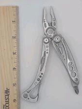 LEATHERMAN Skeletool Multi Tool Serrated Blade Knife Pliers Carabiner VGUC!