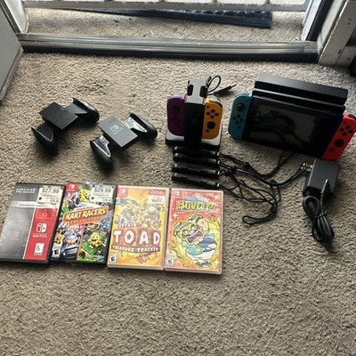 Nintendo Switch Console with Joy-Con Controllers, Charging Dock, & Games.