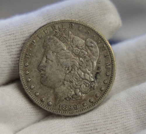 1899 O  US Morgan Silver Dollar $1 XF (Cleaned)