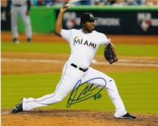 ARQUIMEDES CAMINERO   MIAMI MARLINS   ACTION SIGNED 8x10
