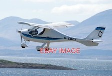 PHOTO  G-CBEX A 2001 BUILT FLIGHT DESIGN CT2K TAKES-OFF FROM OBAN AIRPORT.