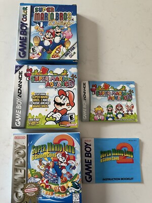 Super Mario Bros Advance, Deluxe, & 6 Golden Coins Box Only & 2 Manuals lot of 3