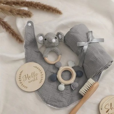 Newborn Baby Gift. set that includes a bib, comb, teether, blanket and rattle
