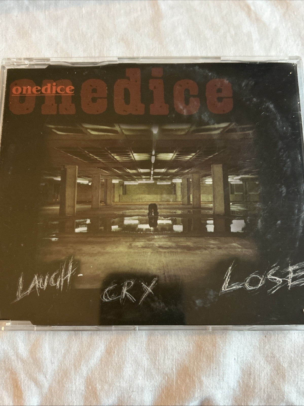 One dice CD single - laugh cry lose