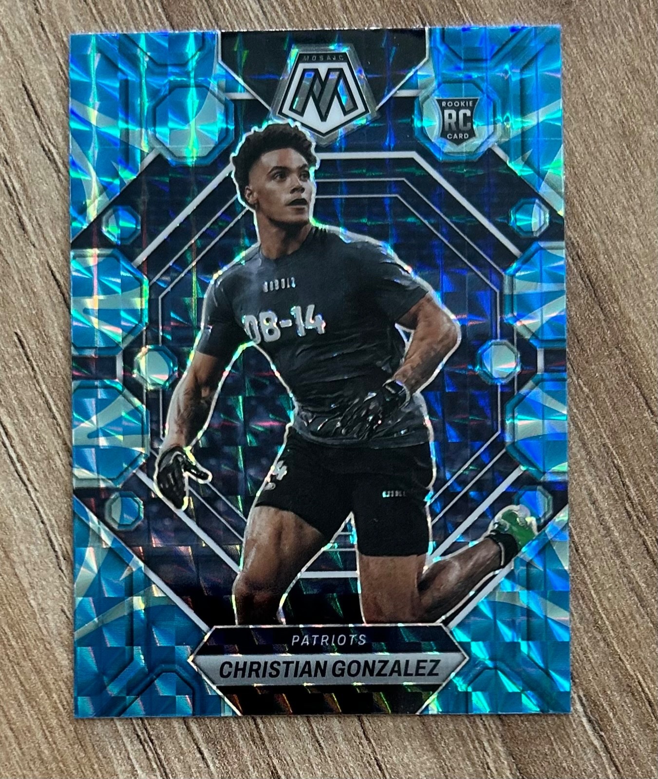 2023 Panini Mosaic Christian Gonzalez RC Reactive Blue #300 New England Patriots