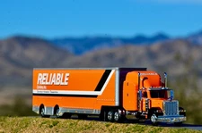 1/64 SpecCast Reliable Carriers 379 Peterbilt and Drop Deck Trailer for DCP