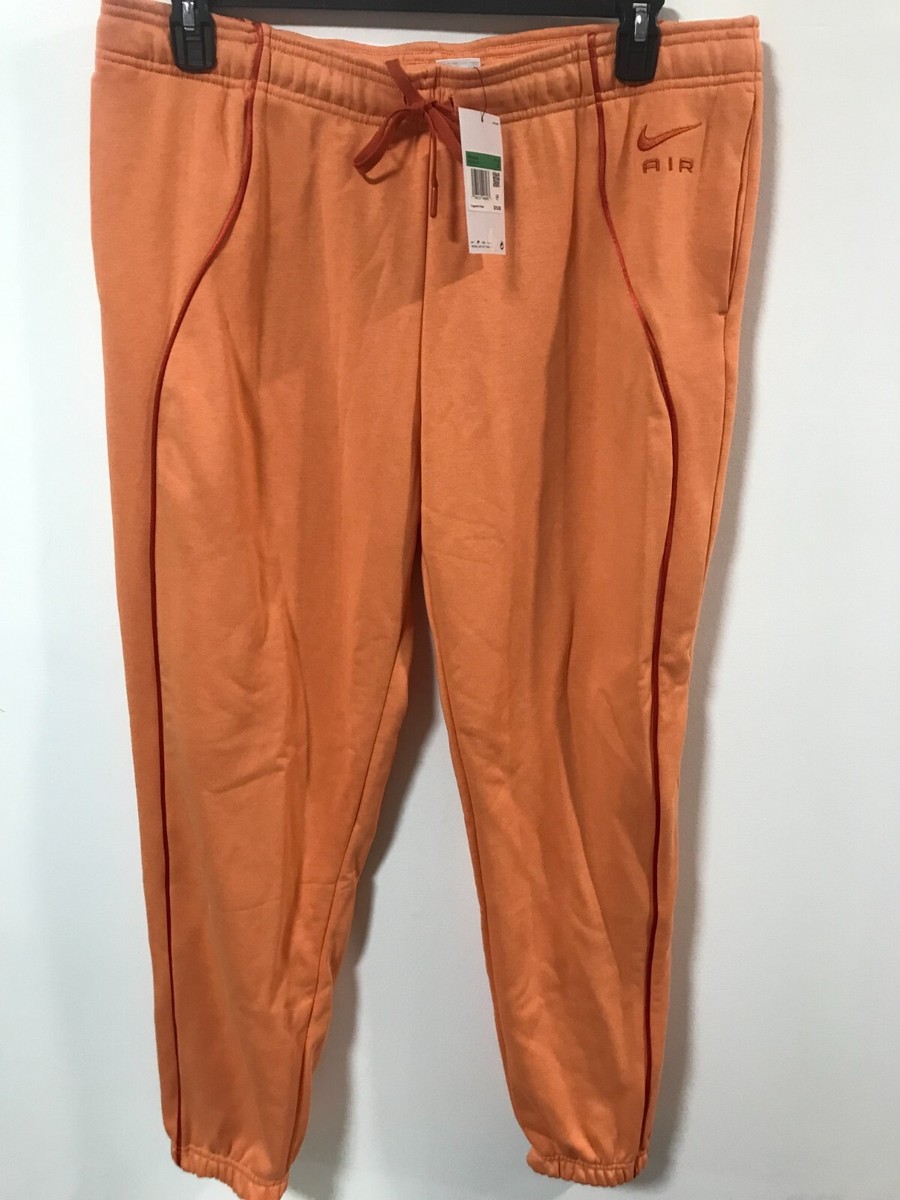 orange nike joggers womens
