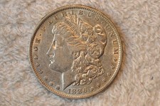 1886-O  AU  MORGAN DOLLAR