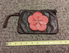 Hand Tooled Leather Clutch With Leather Floral Adornment Zippered Closure