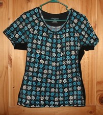 Cherokee Scrub Top Pockets print Size: Medium stretch sides Fancy design flowers