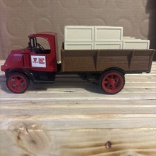 Ertl Collectibles die-cast model of a 1918 Mack AC Bulldog Flatbed Truck