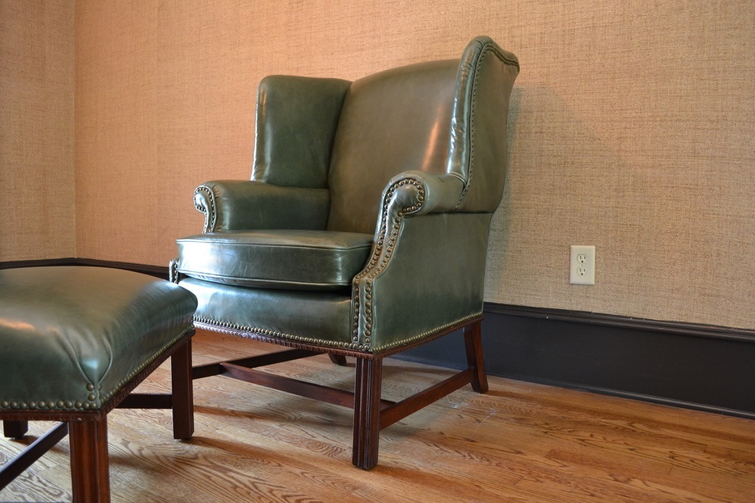 Late 20th Century Leather Chippendale Wing Chair and Ottoman
