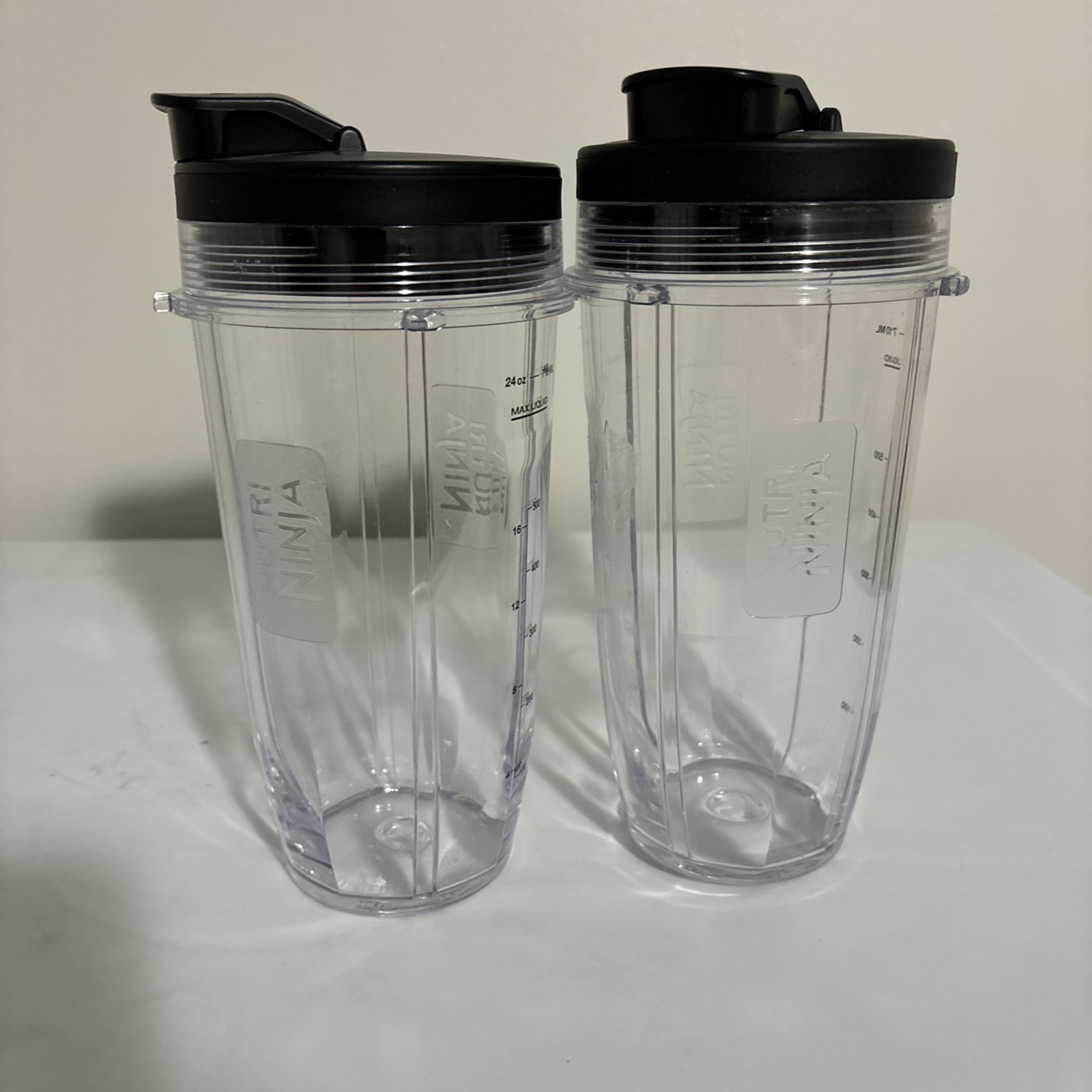Two Nutri Ninja 24oz Bullet Blender Cups; Both Come with To Go Lids