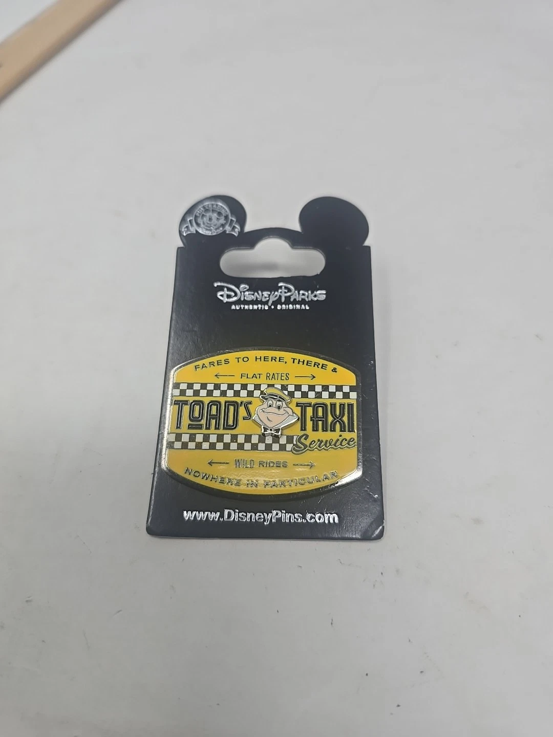 Disney Pin - Mr Toads Wild Ride - Toad’s Taxi Service Fares To Here There …..