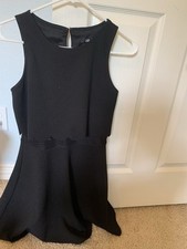black dress with ruffles at top, a bit see through in the middle