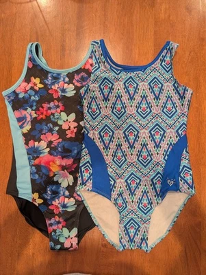 Lot Of 2 Justice Swimsuits One Piece Floral Black & Aqua and Geometric Blue (10) - Image 1 of 4