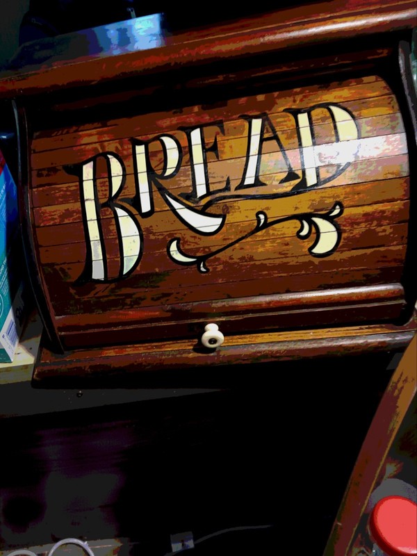 Vintage wooden rolltop bread box