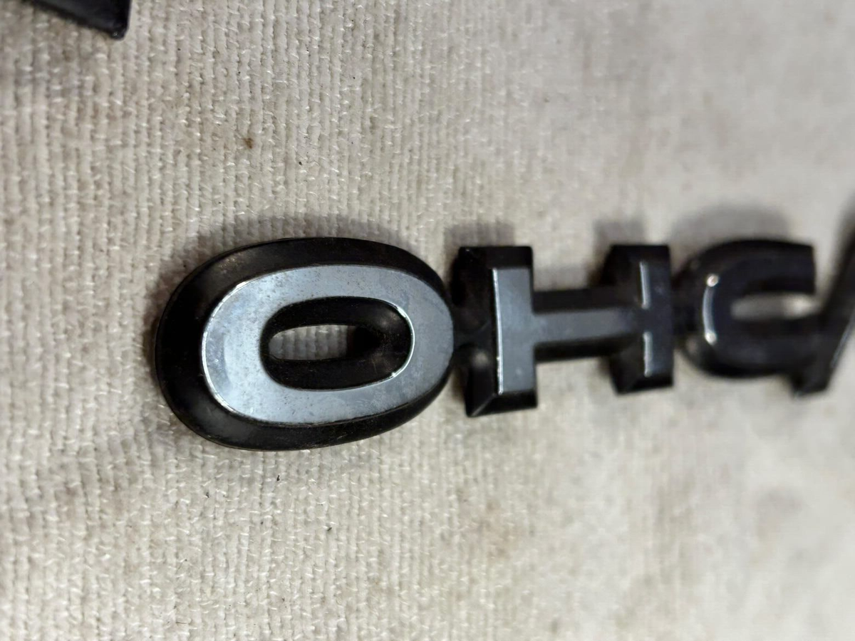 84-91 Pontiac Sunbird J2000 Front Fender OHC/FI Emblem Badge BLACK