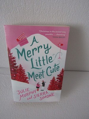 A Merry Little meet Cute paperback book by Julie Murphy and Sierra Simone