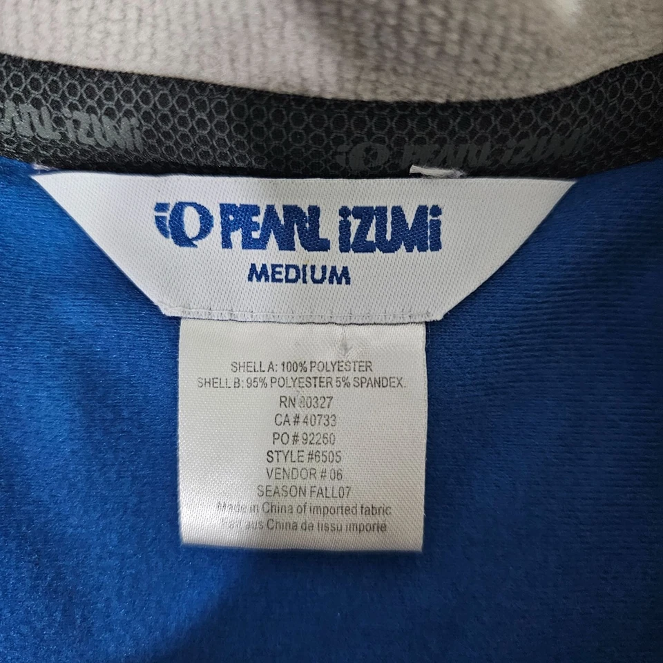 Chaqueta de ciclismo reflectante Pearl Izumi mediana azul gris acolchada cremallera completa para mujer Foto 3 de 4