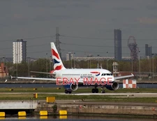 PHOTO  G-EUNA A BRITISH AIRWAYS 2009 BUILT AIRBUS A318-112 TAXIS FOR DEPARTURE F