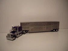 DCP FIRST GEAR 1/64 PURPLE PETE 389 W/T 70'' SLEEPER & SILVER LIVESTOCK TRAILER