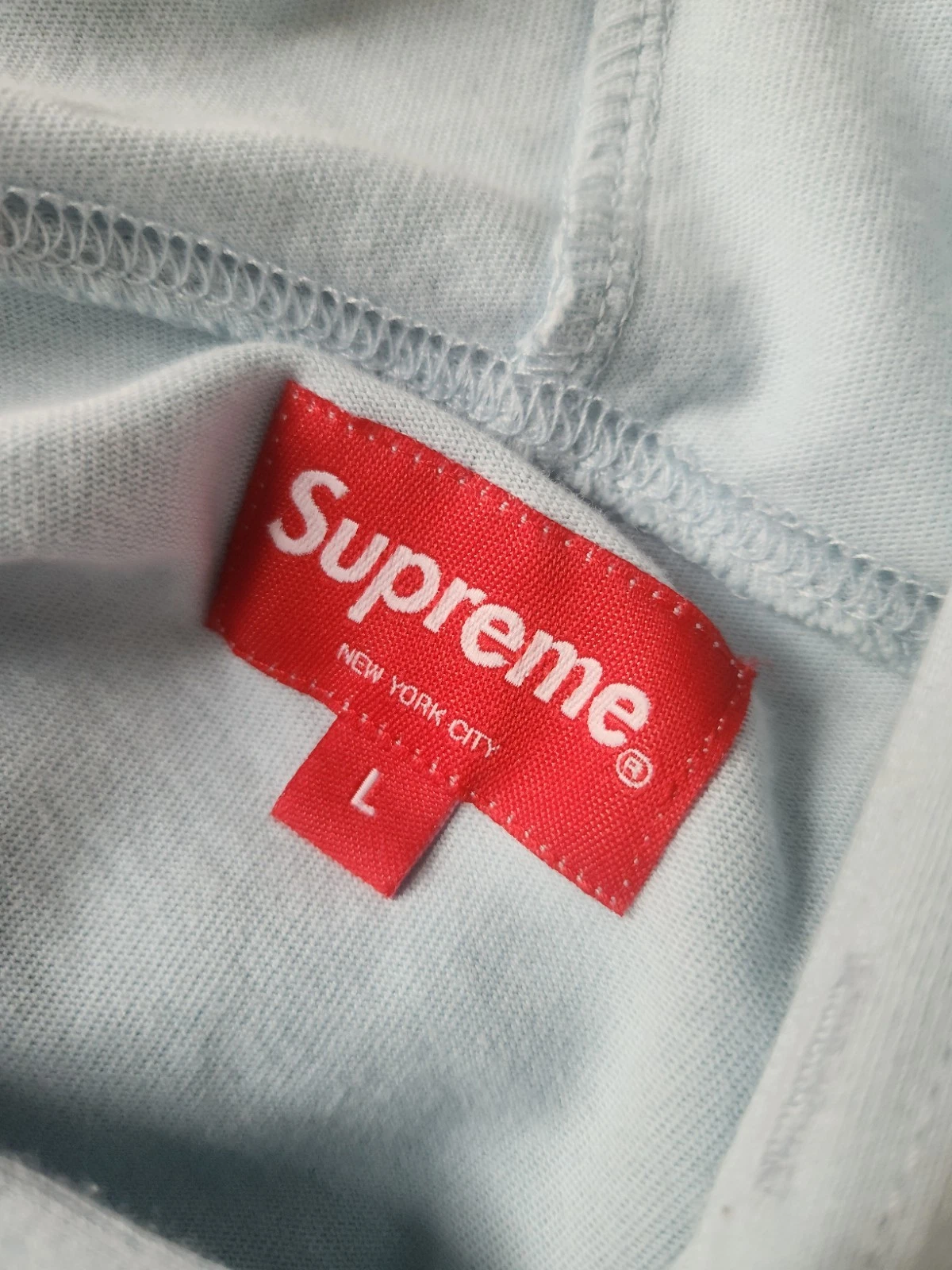 Top SS23 Supreme Celebré con cappuccio L S taglia L grande felpa con cappuccio blu chiaro