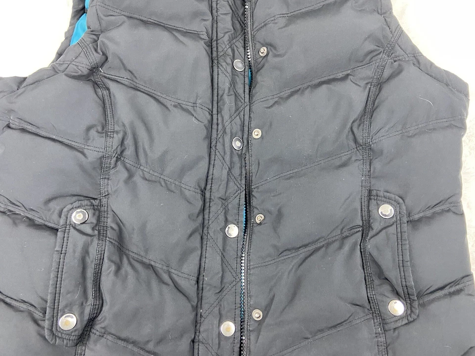 Chaleco Baileys Point Down Fill para mujer grande negro frente a presión con capucha ribete de piel sintética Foto 2 de 4