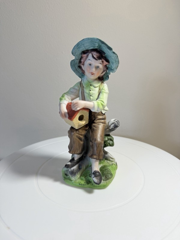 Vintage Boy Holding Birdhouse Sitting on Log Ceramic Figurine 6.5" Height