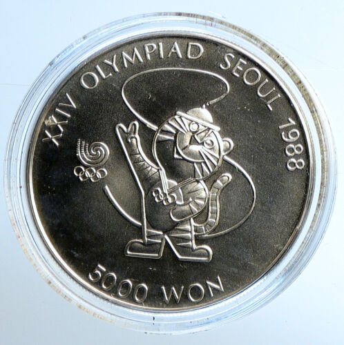 1986 SOUTH KOREA Seoul 1988 OLYMPIC GAMES MASCOT Silver 5000 Won Coin i110872 - Picture 1 of 3