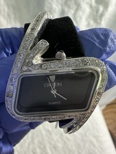 Woman s Croton Quartz Watch Rhodium Plating Black dial adorned with crystals