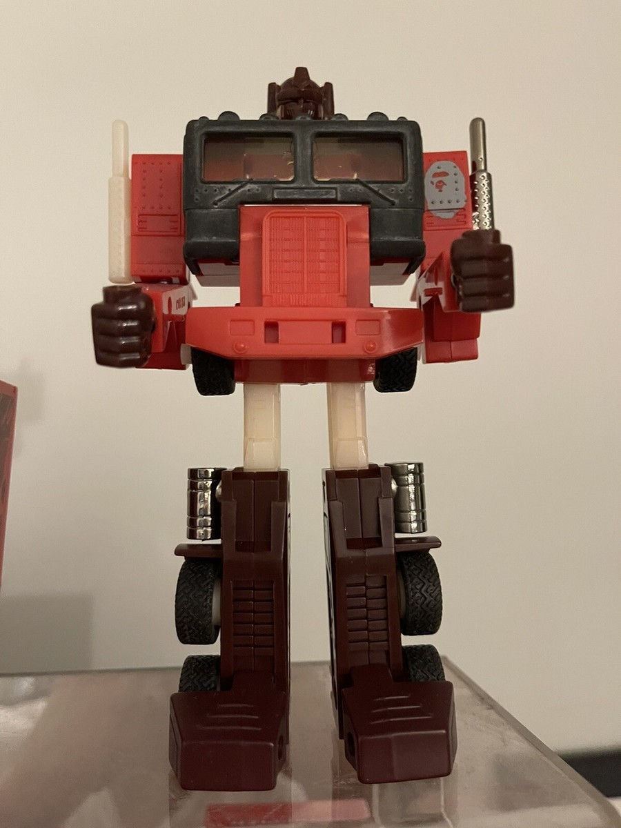 その他 A BATHING APE - TRANSFORMERS OPTIMUS PRIME BAPE(R) RED Transformers A Bathing Ape BAPE G1 Optimus Prime Convoy RED