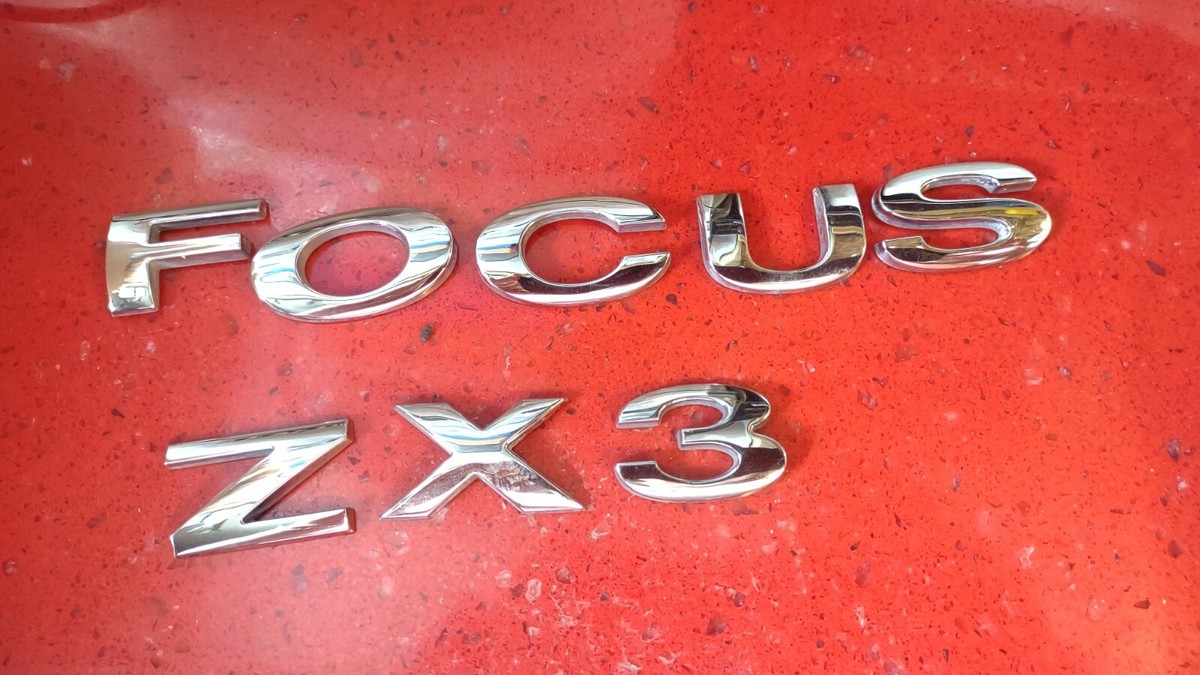 Focus ZX3 EMBLEM OEM LUGGAGE COMPARTMENT 2004-2007 FOCUS 6S4Z