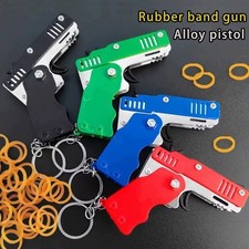 Metal Burst Rubber Band Toy - Mini Folding Launcher Toy With Keychain And 60pcs