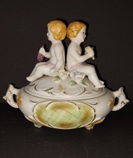 Bomboniera coperchio barattolo biscotto porcellana putti angelo oro bianco rose uva Italia