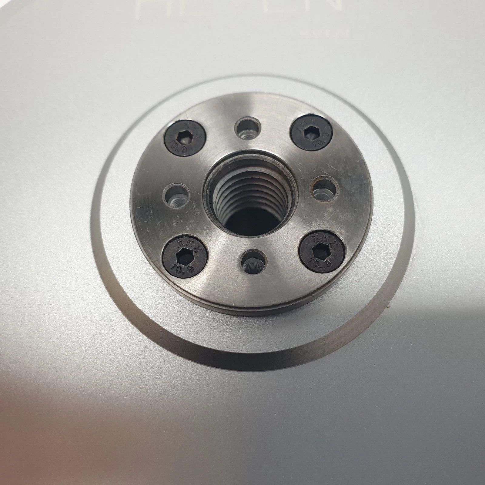 Steel center hub of the P150 with threaded bore and four socket screws