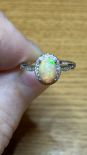  30B- .85ct Genuine Ethiopian Welo Opal set in a Size 7 925 Sterling Silver Ring